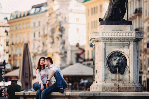 Photography Couple in love sitting near fountain