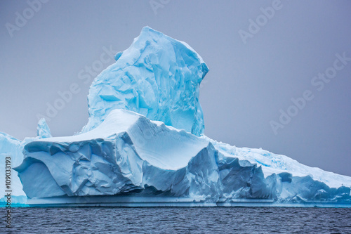 Part of the blue beautifull larger iceberg in ocean, Antarctica 