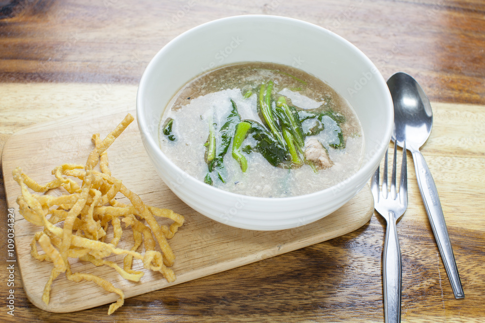 Fried noodle in Gravy on wooden background Fried noodle in Gravy on wooden background