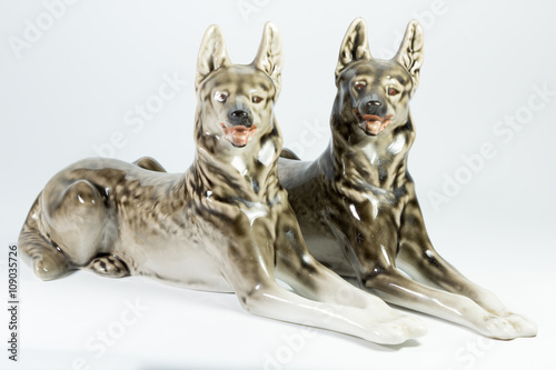 pair of porcelain dogs on white background