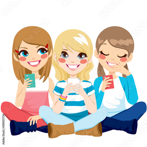 Cute girls sitting on floor using their smartphones smiling happy