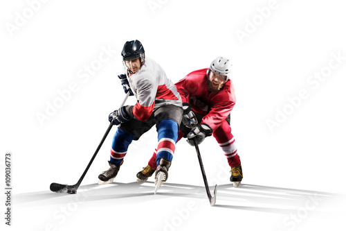 Professional hockey player skating on ice Isolated in white photo