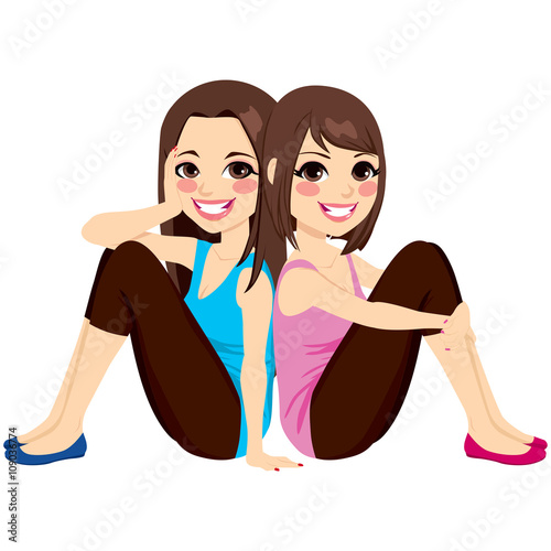 Beautiful brunette women sitting back to back on floor smiling happy