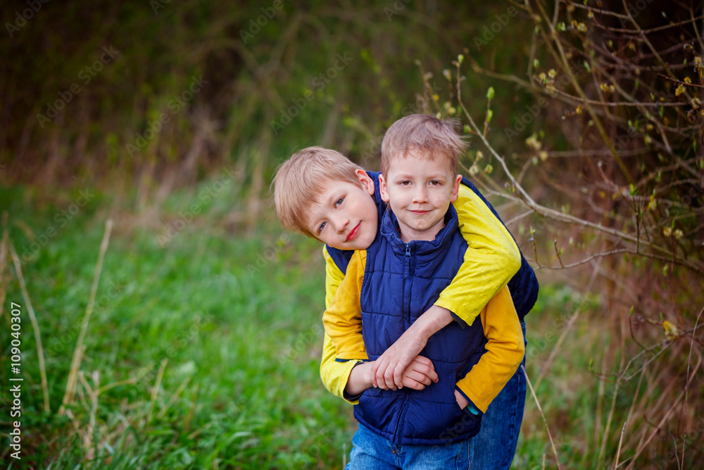 Portrait happy sibiling brothers together in the park. Portrait happy sibiling brothers together in the park.