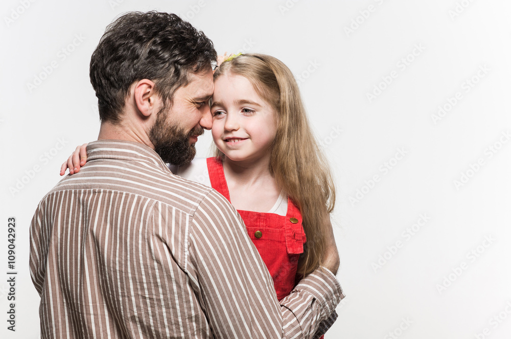 Girl hugging her father over a white background Girl hugging her father over a white background