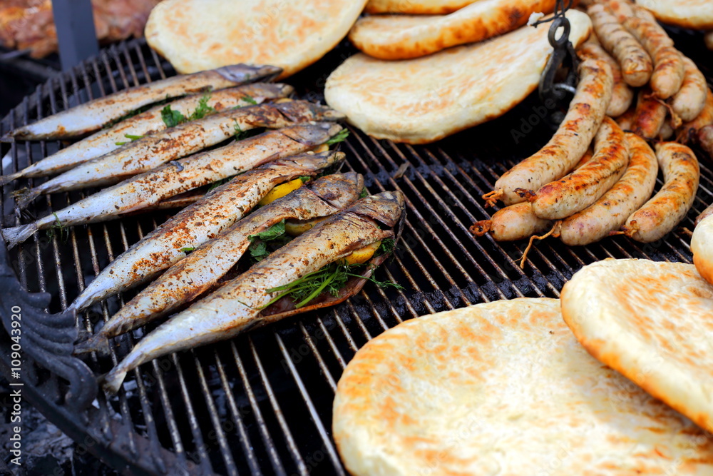 Preparing food on the grill outside. Preparing food on the grill outside.