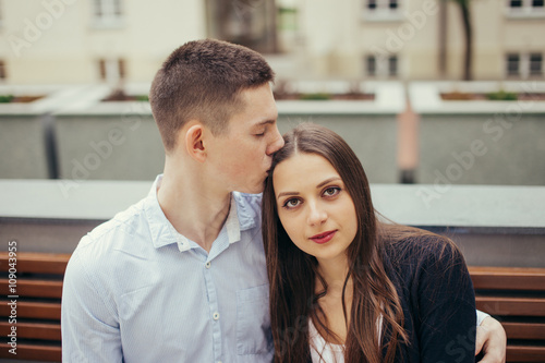 Lovely couple sitting in the park background © Serhiy Hipskyy