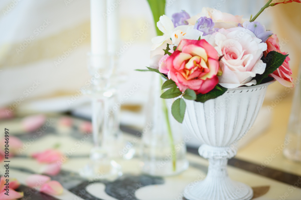 Fototapeta premium Parts of decorative composition near table. Bridal wedding style