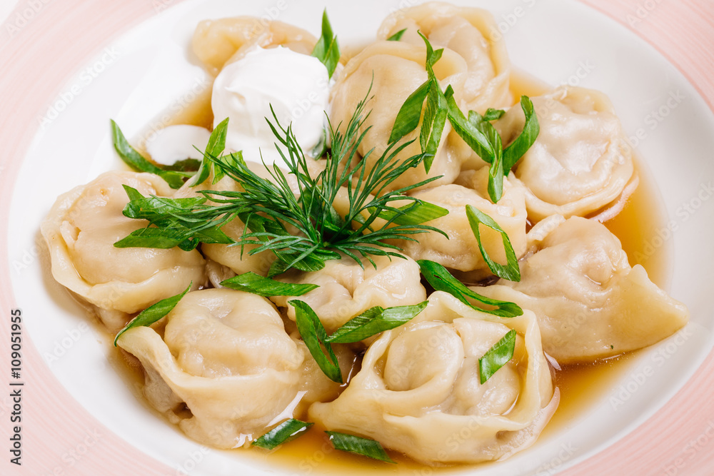 Boiled prepared homemade russian dumplings or pelmeni with beef Boiled prepared homemade russian dumplings or pelmeni with beef