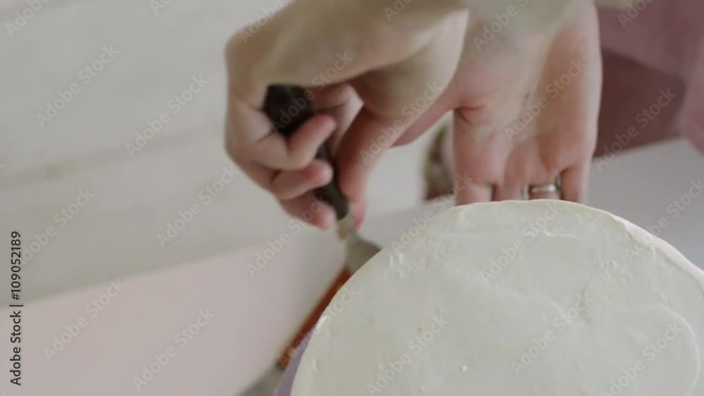 Woman is making cakes in the kitchen