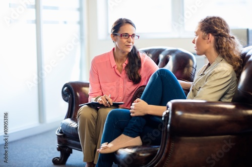  Psychologist having session with her patient in office