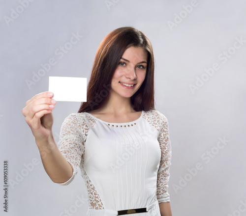 young business woman with empty busineess card photo