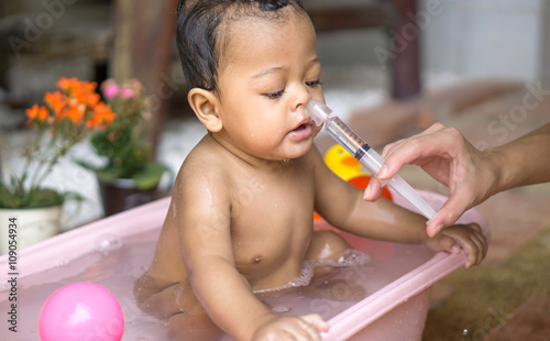 Asian baby saline nasal wash