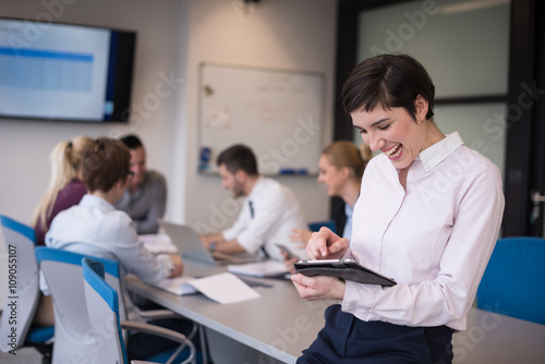 business woman on meeting using tablet