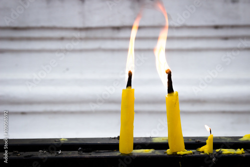 Yellow candles in the temple