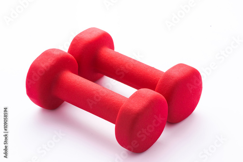 Red dumbbells on a pure white background with space for text