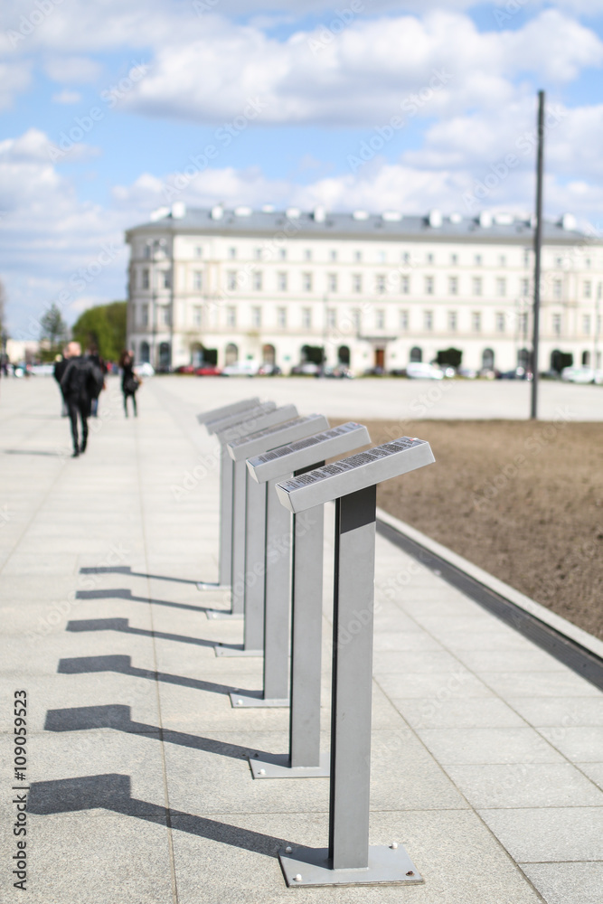 Information posts with shadows next to the Tomb of the Unknown Soldier in Warsaw