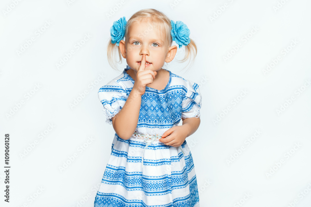 Beautiful baby girl on a white background making shh Beautiful baby girl on a white background making shh