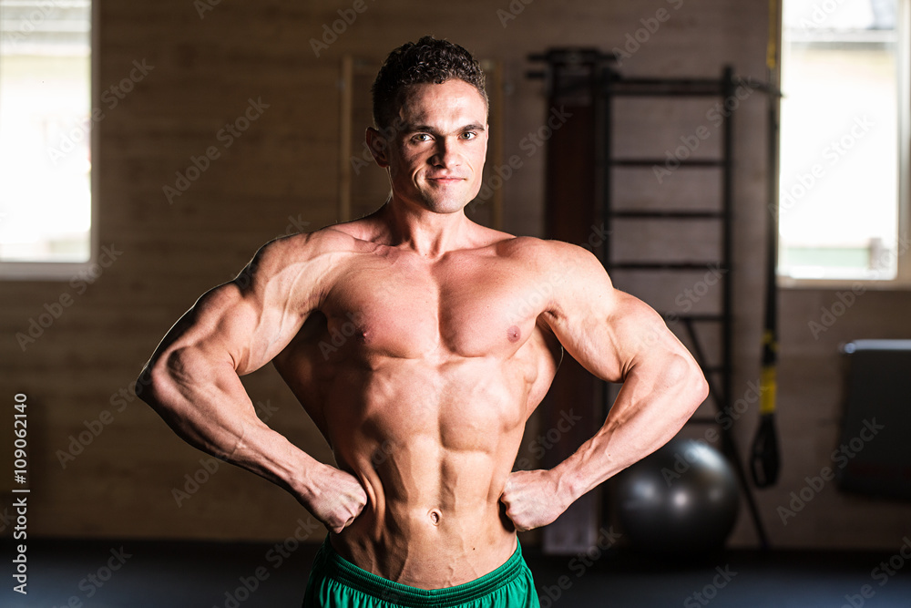 Fototapeta premium Strong Athletic Man Fitness Model Torso showing six pack abs