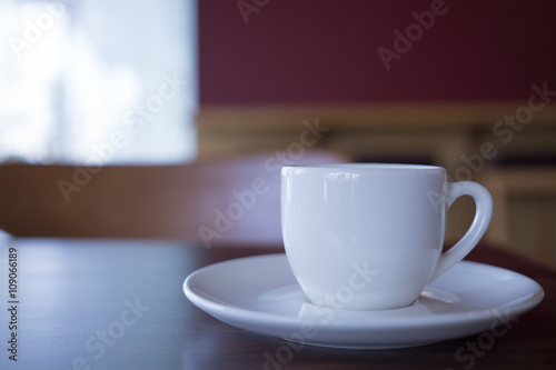 Cup of hot coffee put on the table