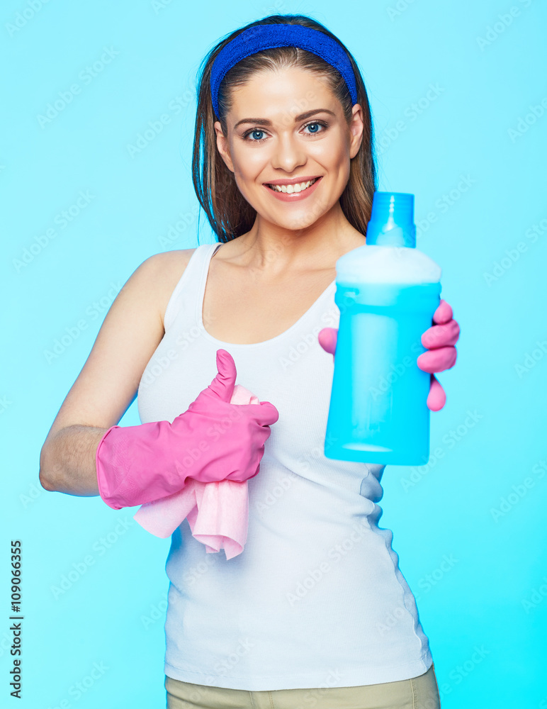 Smiling woman holding bottle of chemistry for cleaning house sh