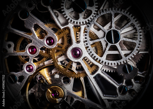 Mechanism, clockwork of a watch with jewels, close-up. Vintage luxury