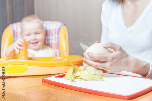 Mother cooking, preparation of baby food photo