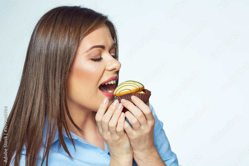Young woman biting french cookie. Close up face portrait