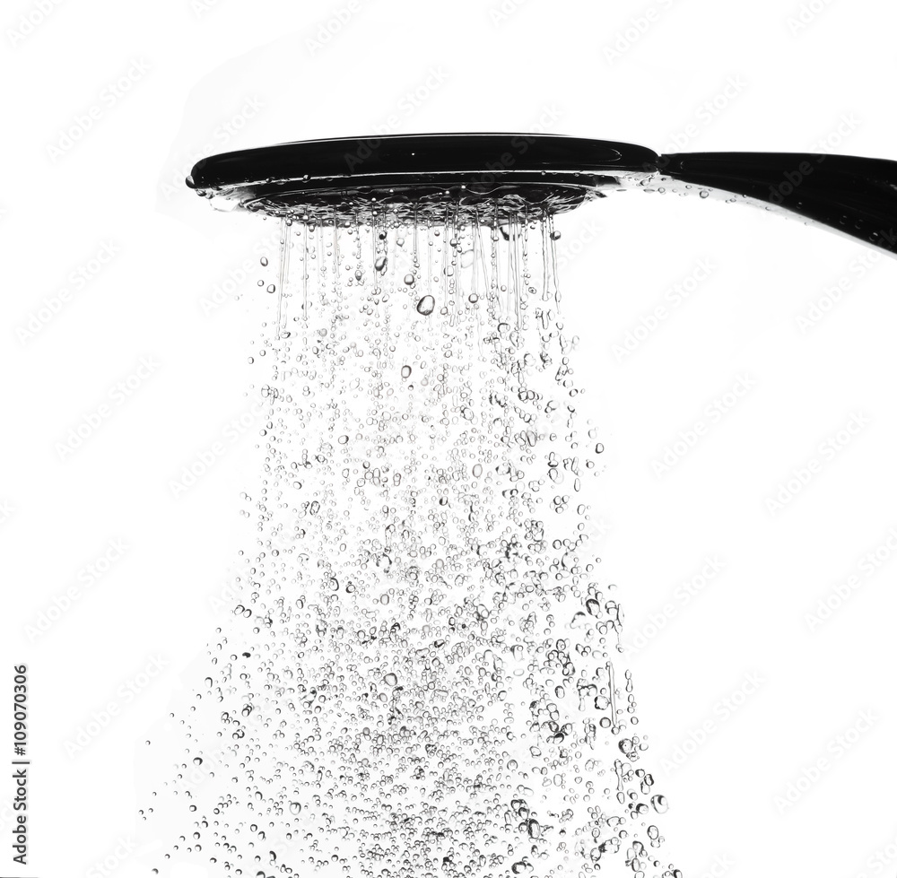 Water drops from shower head in bathroom on white background Water drops from shower head in bathroom on white background