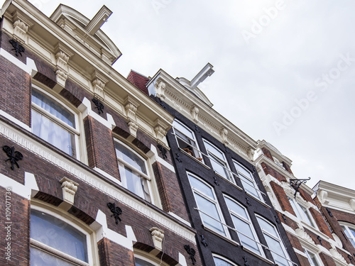 AMSTERDAM, NETHERLANDS on MARCH 28, 2016. Typical architectural details of houses XVII-XVIII of construction. photo