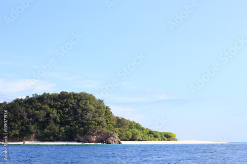 Gorgeous Beach and tropical blue sea in Summertime, rough rock stone