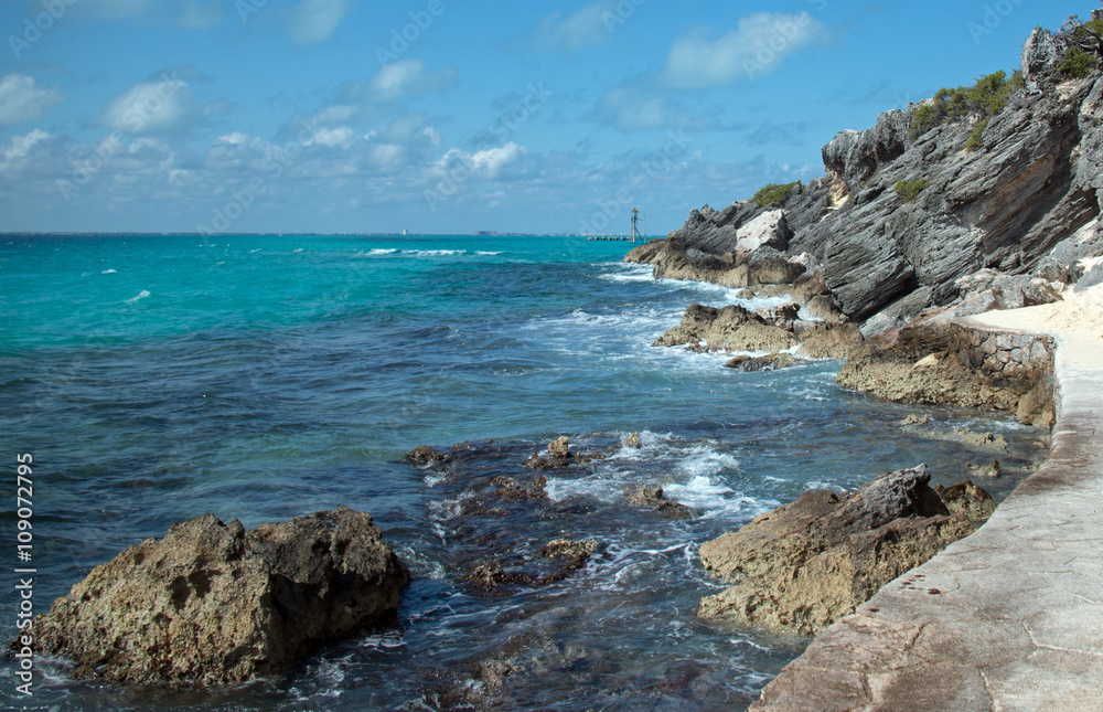 Isla Mujeres (island of the women) - Looking west across the Caribbean toward Cancun at Punta Sur (south point) also called Acantilado del Amanecer (Cliffs of the Dawn) Isla Mujeres (island of the women) - Looking west across the Caribbean toward Cancun at Punta Sur (south point) also called Acantilado del Amanecer (Cliffs of the Dawn)