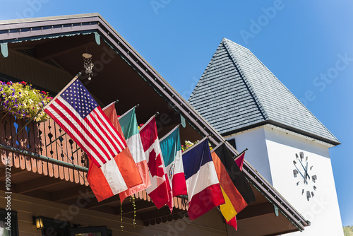 Flags of European and North American countries hanging off of balcony in Vail, Colorado