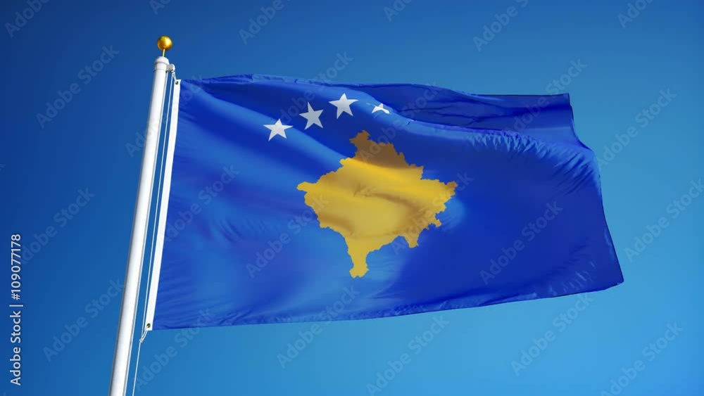 Kosovo flag waving in slow motion against clean blue sky, seamlessly looped, close up, isolated on alpha channel with black and white luminance matte, perfect for film, news, digital composition