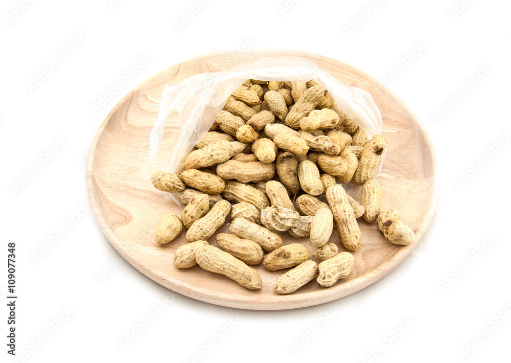 Wooden dish of nuts on white wooden background Wooden dish of nuts on white wooden background