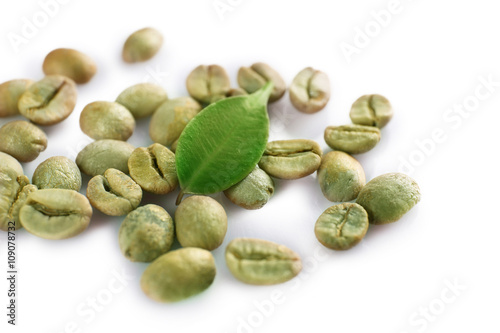 Green coffee beans on white background