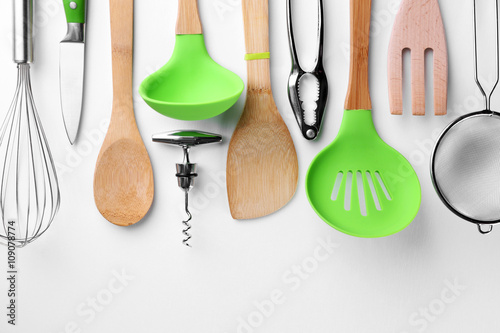 Set of stainless and wooden utensils, isolated on white photo