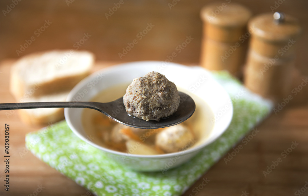 soup with meatballs in a white plate soup with meatballs in a white plate