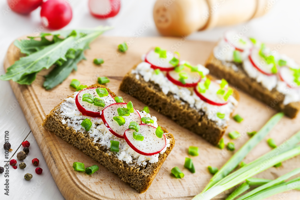 Ray bread with soft cream cheese and radish. Delicious vegetarian food. Ray bread with soft cream cheese and radish. Delicious vegetarian food.