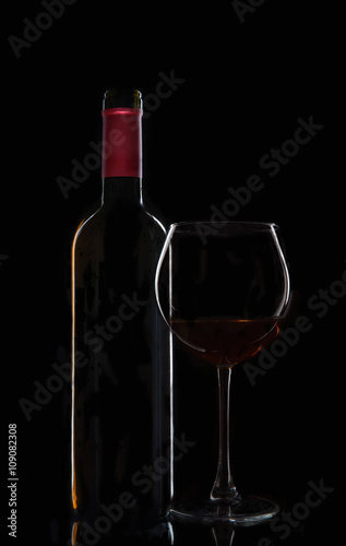 bottle of wine with a glass