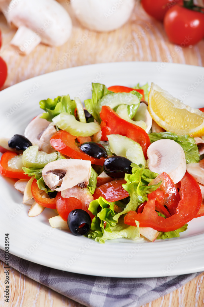 Fresh vegetable salad on the wooden table