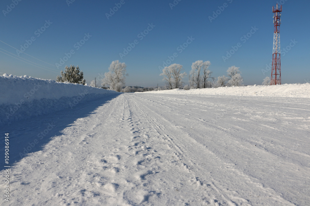 Road in snow in cold winter day Road in snow in cold winter day