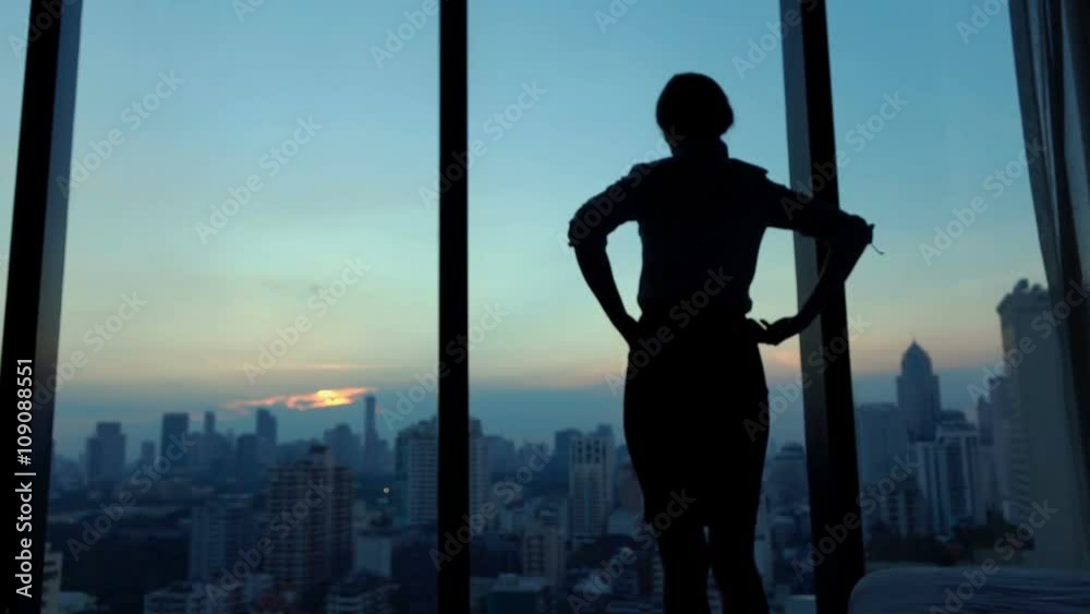 Young businesswoman admire cityscape at night, slow motion
