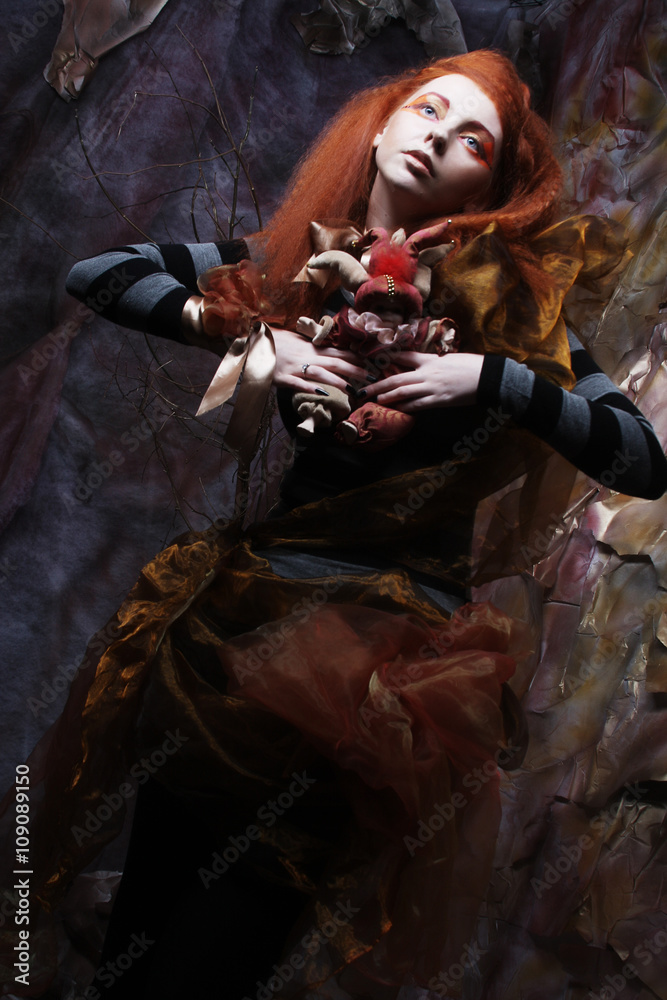 lady with artistic make-up with doll lady with artistic make-up with doll