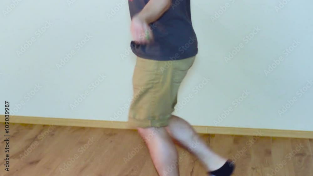Man Jumping on Skipping Rope in T-Shirt Indoor Man Jumping on Skipping Rope in T-Shirt Indoor