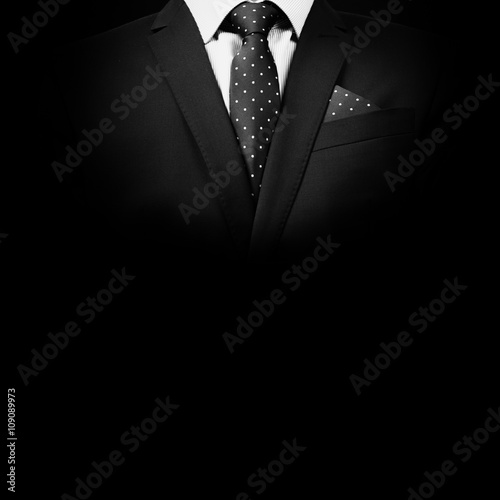 man in suit on a black background photo