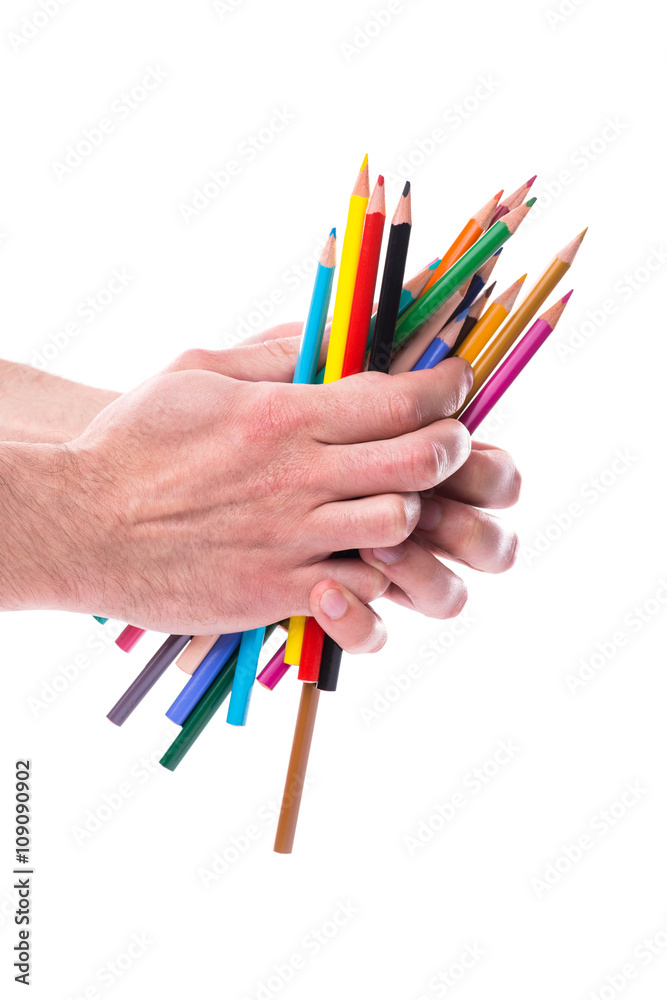 Bunch of color pencils in hands