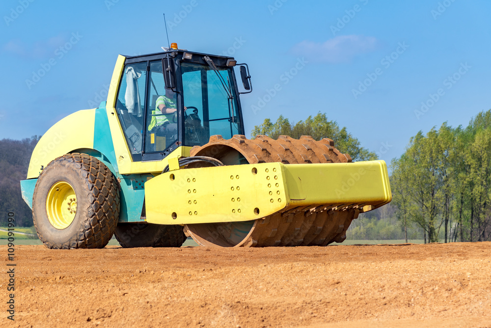 Fototapeta premium Compactor working on the construction site