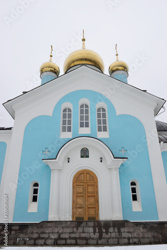 The entrance to blue stone Orthodox Church photo