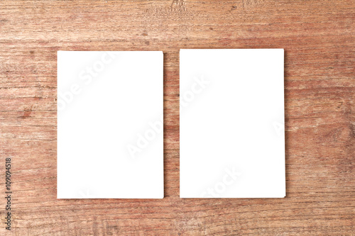 Top view of Blank paper with empty space mock up on wood backgro